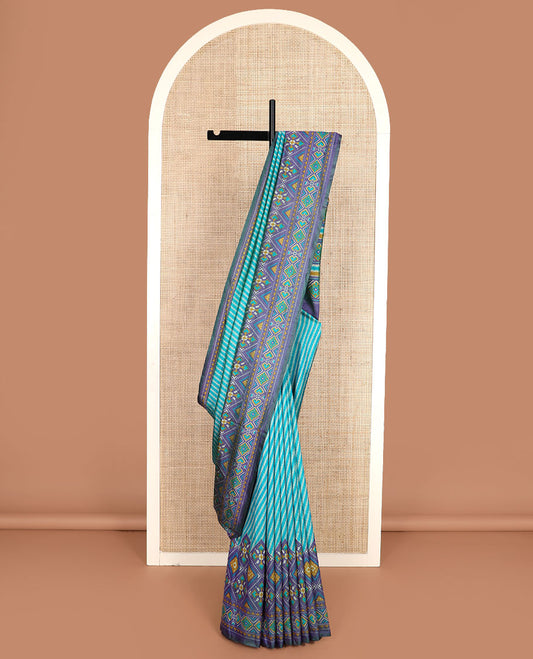 Blue diagonal striped semi-banaras patola silk saree, contrast diamond and elephant motif border, and pallu of diamond design