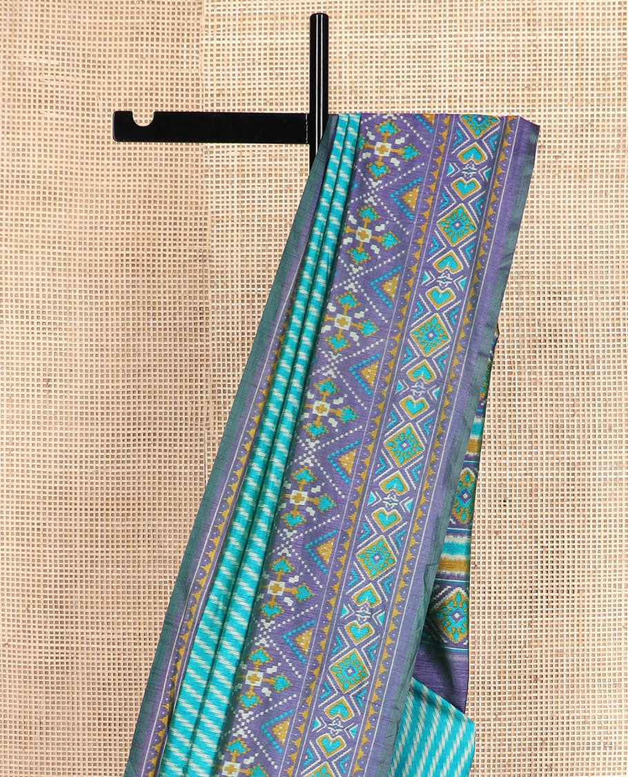 Blue diagonal striped semi-banaras patola silk saree, contrast diamond and elephant motif border, and pallu of diamond design