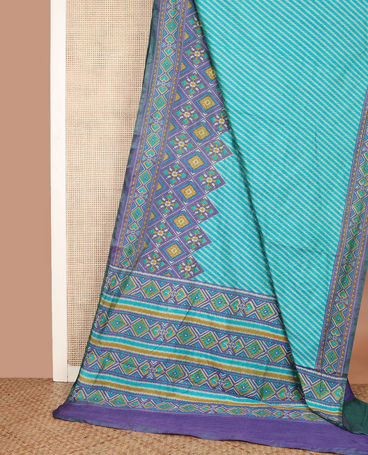 Blue diagonal striped semi-banaras patola silk saree, contrast diamond and elephant motif border, and pallu of diamond design