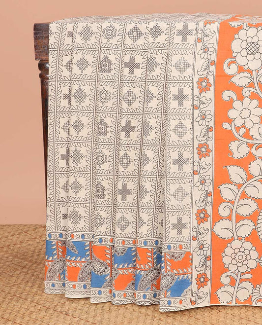 Cream Machine-Printed Kalamkari Cotton Saree Features Kolam Motifs Enclosed Checks on Its Body, Complemented by Contrast Printed Border, Pallu Depicts Floral and Peacock Print, and Paired with a Floral Printed Blouse