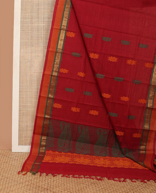 Maroon striped kanchi cotton saree with floral buttas, contrast zari border & paisley design pallu