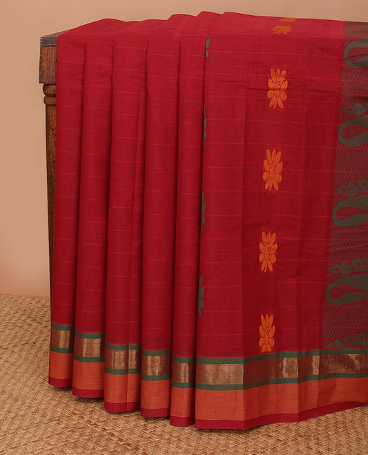 Maroon striped kanchi cotton saree with floral buttas, contrast zari border & paisley design pallu