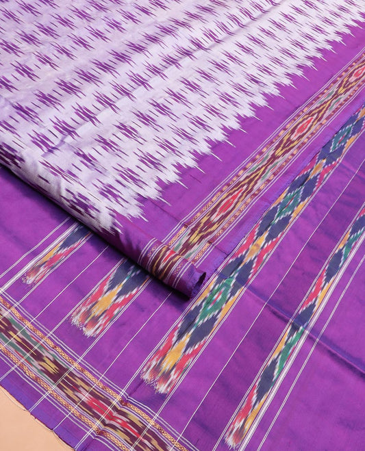 Grey Ikkat Silk Saree with Buttas Across the Body, spotlighted with a Contrast temple Ikkat-Textured Border, and Pallu Features Stripes and Ikkat Texture