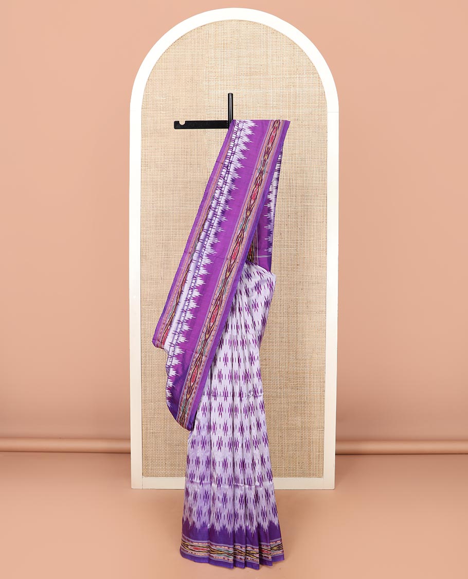 Grey Ikkat Silk Saree with Buttas Across the Body, spotlighted with a Contrast temple Ikkat-Textured Border, and Pallu Features Stripes and Ikkat Texture
