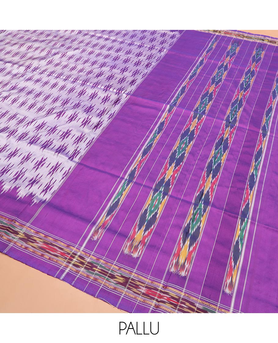 Grey Ikkat Silk Saree with Buttas Across the Body, spotlighted with a Contrast temple Ikkat-Textured Border, and Pallu Features Stripes and Ikkat Texture