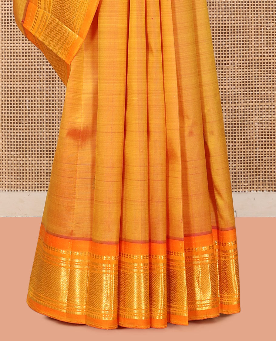 Orange Kanchipuram Silk Saree, Woven with Zari Buttas, a Contrast One-Sided Border of Panner Sombu, Banaras, Muthu, and Jaal Designs, a Zari Design Pallu, and No Blouse