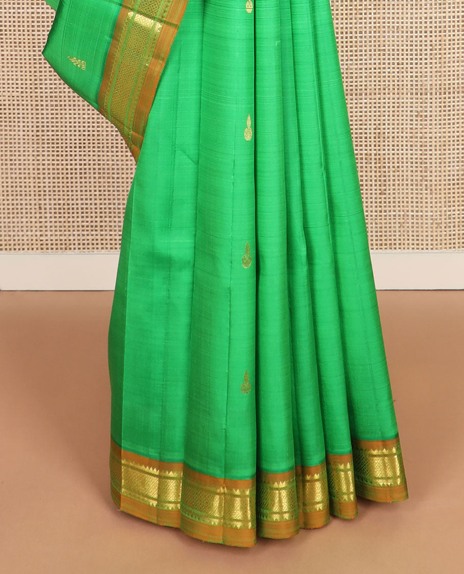 Green zari buttas kanchipuram silksaree, contrast one-sided border of thazampoo rekku,banaras & jaal design & zari design pallu