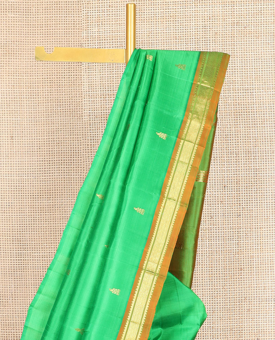 Green zari buttas kanchipuram silksaree, contrast one-sided border of thazampoo rekku,banaras & jaal design & zari design pallu
