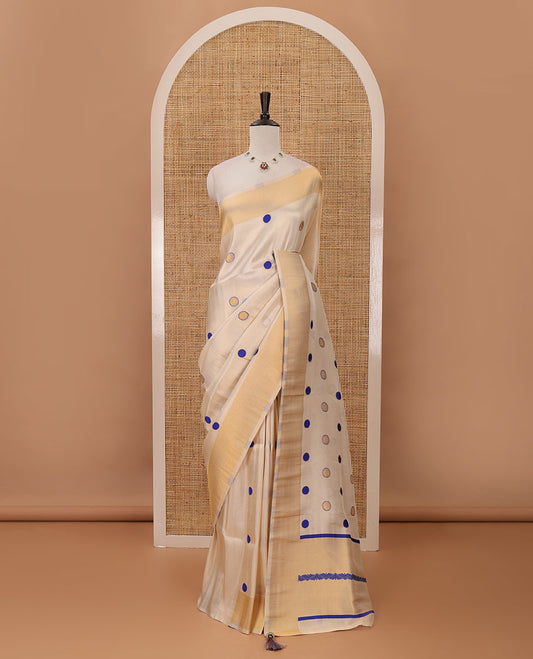 Cream small blue polka dots banarasi tissue saree, zari border, pallu of blue polka dots & running plain blouse