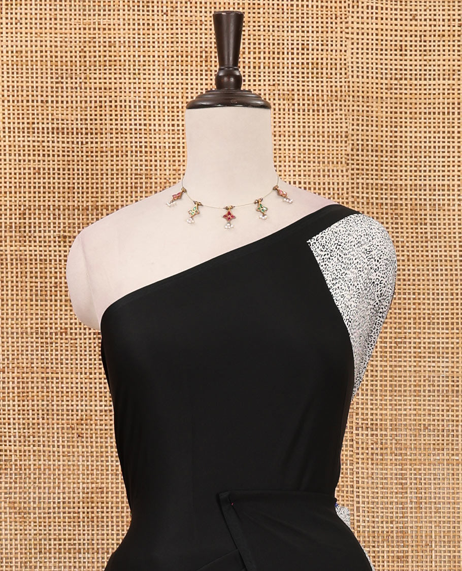 Borderless black abstract-style & leopard-skin-style printed satin crepe saree, plain black blouse