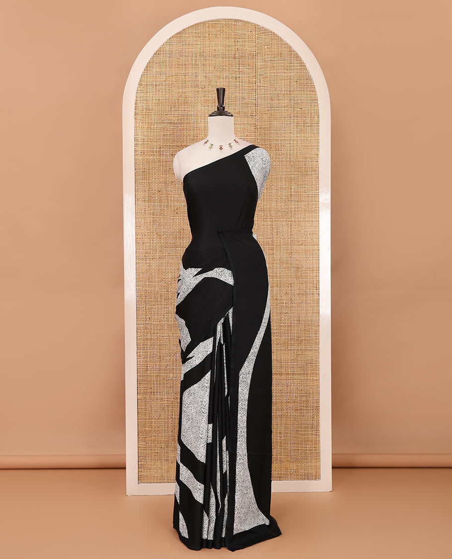 Borderless black abstract-style & leopard-skin-style printed satin crepe saree, plain black blouse