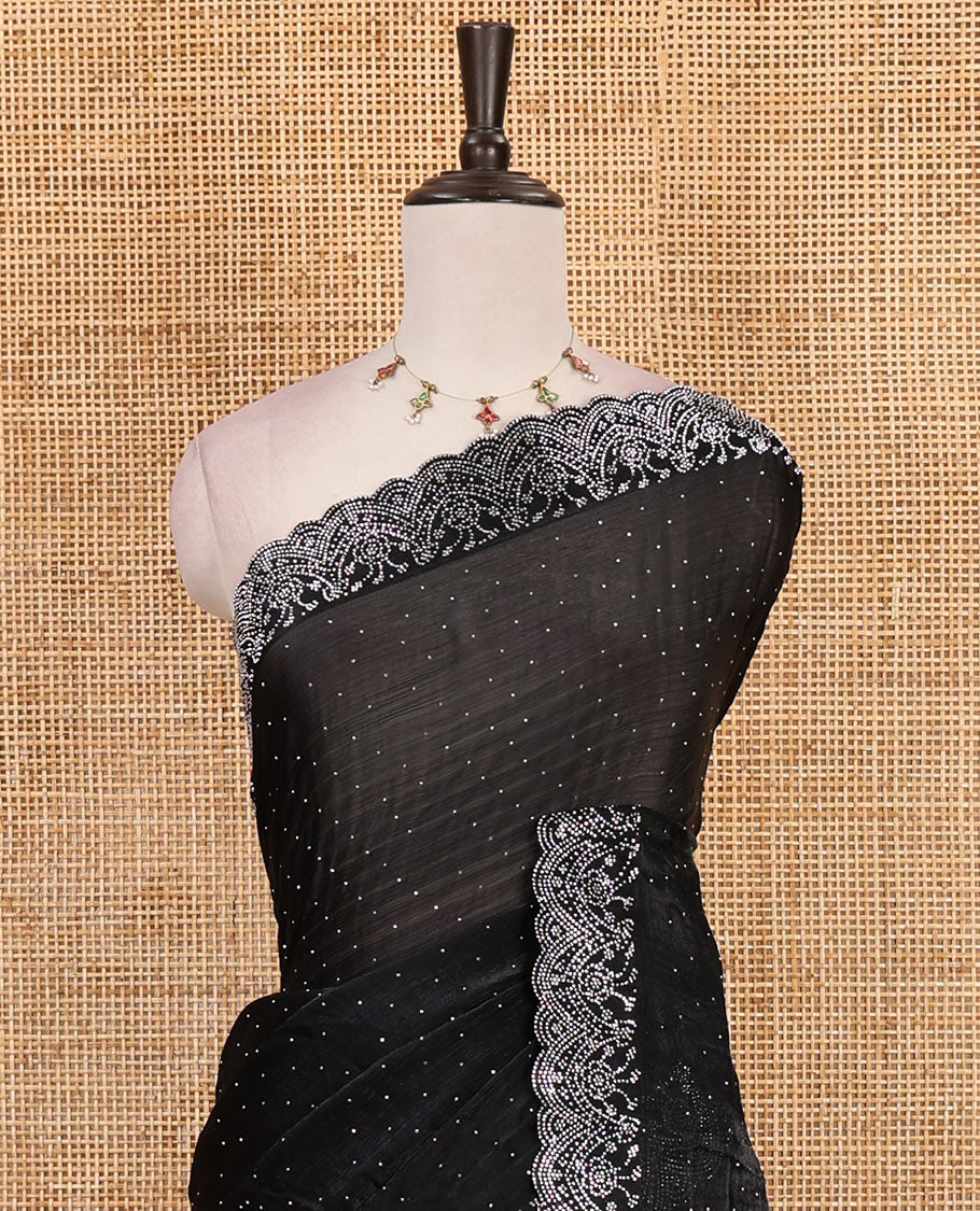 Black Swarovski crystal stone embedded fendy chiffon saree, scallop border accentuated with floral and scallop design in Swarovski stones