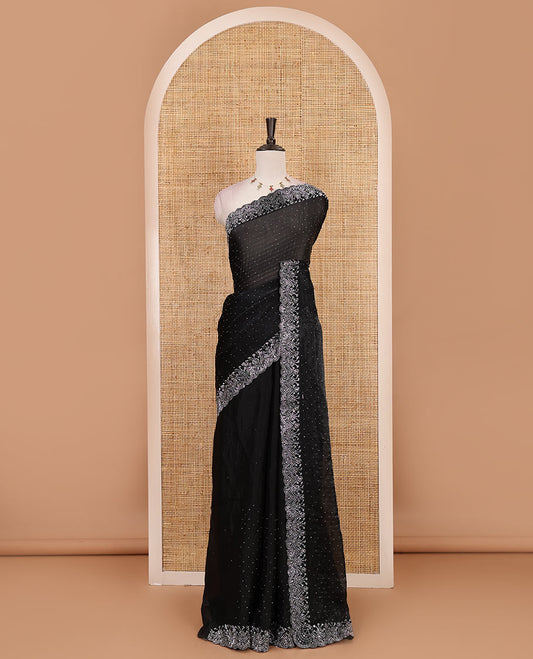 Black Swarovski crystal stone embedded fendy chiffon saree, scallop border accentuated with floral and scallop design in Swarovski stones