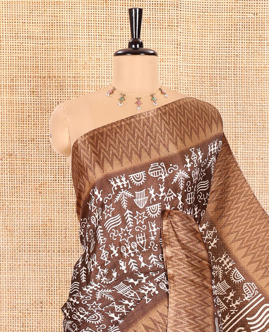 Brown Art Khadi Cotton Saree Beautified with Warli-Village Theme Print, Complemented with a Contrasting Chevron-Printed Border, Vibrantly Warli-Printed Pallu, and a Plain Blouse