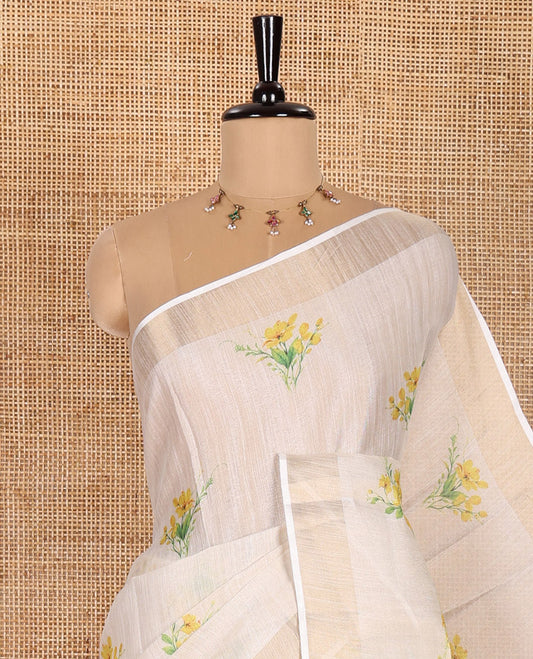 Cream Tissue Saree, Prettified with Yellow Floral Motifs Printed All Over Its Body, Subtle Bavanji Border, Pallu Features Floral Print, and Paired with a Matching Floral Printed Blouse