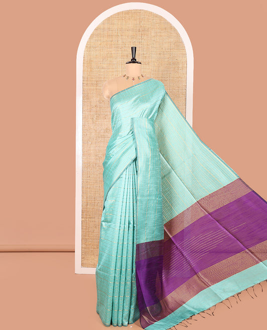Borderless Turquoise Semi-Raw Silk Saree Gleamed Up with Gold-Zari Horizontal Stripes All Over Its Body, Complemented by a Contrast Pallu of Stripes, and Paired with a Contrast Blouse