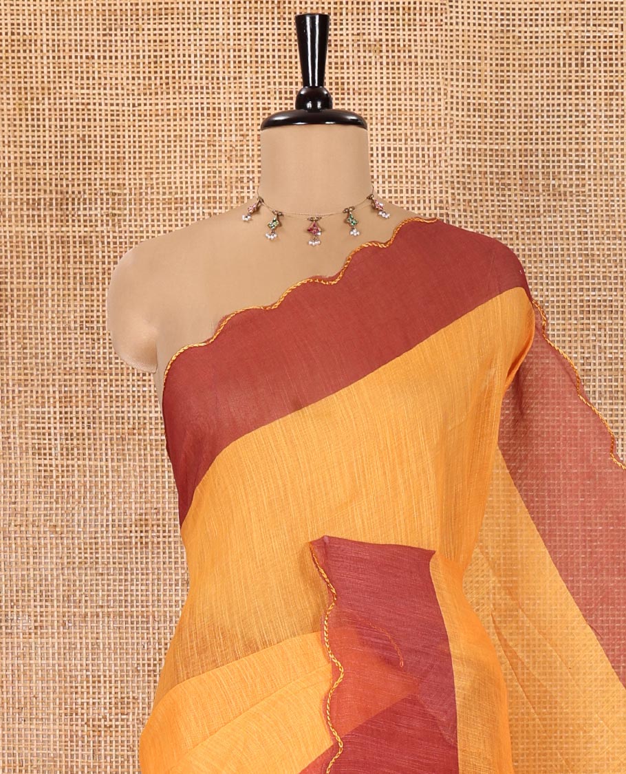 Yellow Plain Linen Cotton Saree, Complemented by Contrast Scallop Border, Plain Pallu, and Paired with a Contrast Floral Printed Mirror Embroidered Blouse