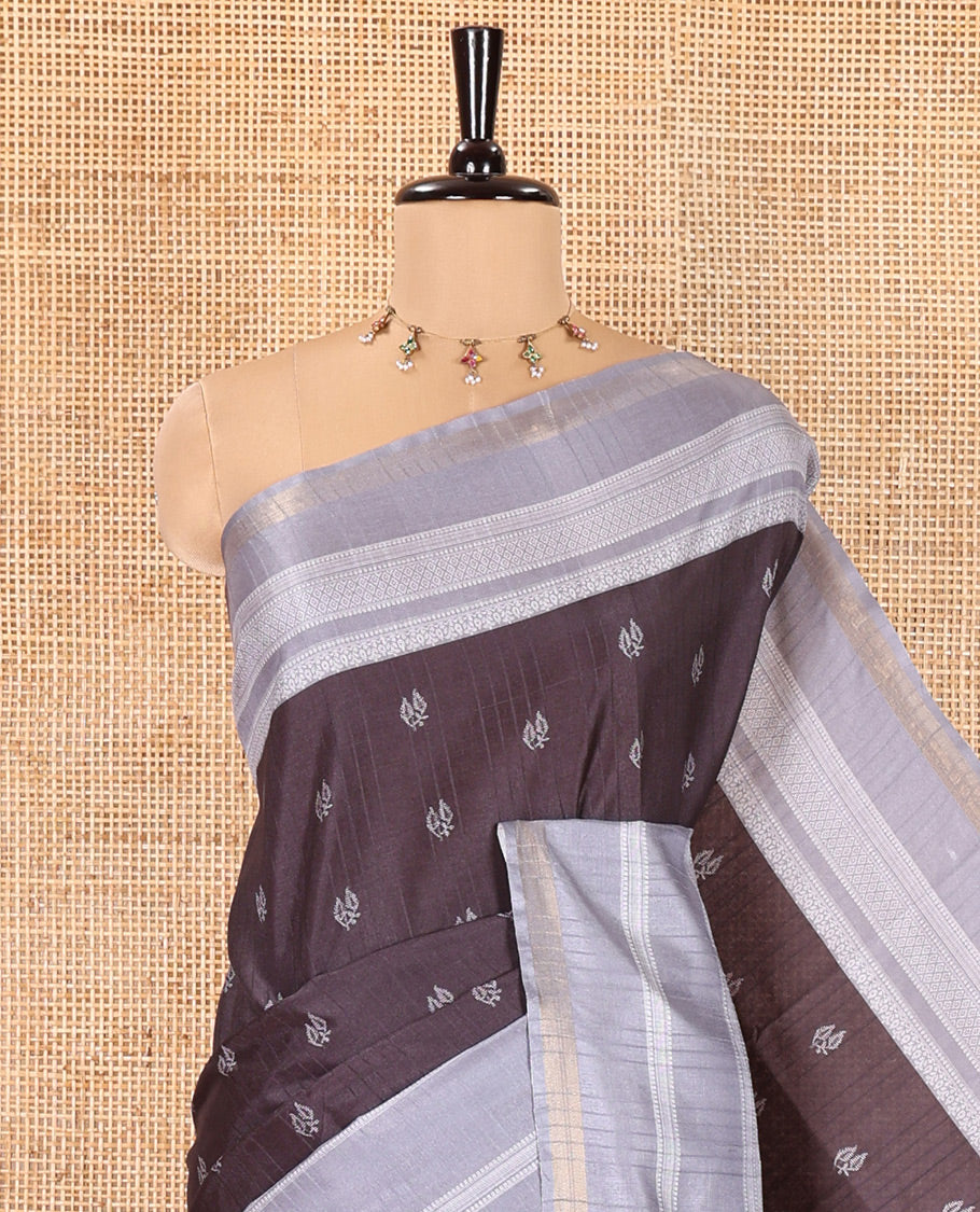 Black Katan Silk Saree, Subtly Steeped with Leaf Motifs Printed All Over Its Body, Complemented by a Contrast Traditional Patterned Border, Pallu Depicting Intricate Designs, and Paired with a Contrast Blouse