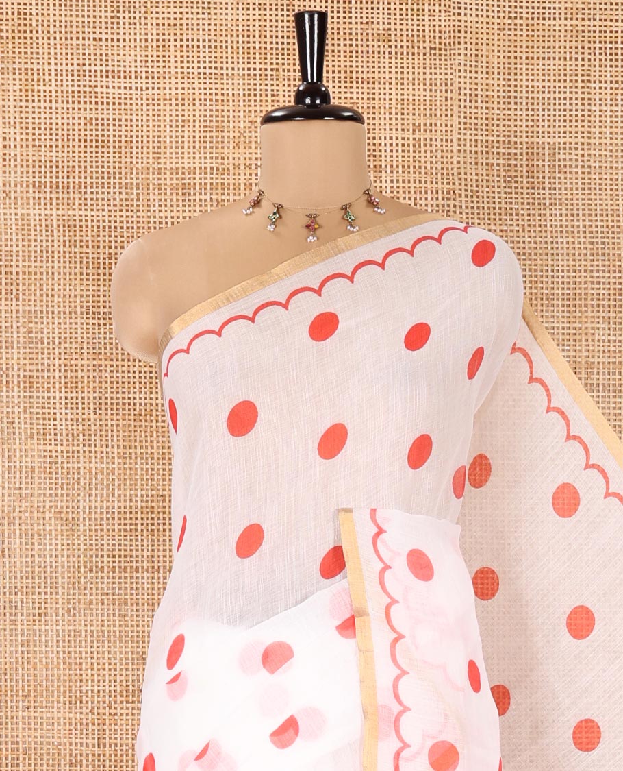 White Linen Cotton Saree, Beautified with Polka Dots All Over Its Body, Subtle Piping Border, Self-Pallu, and Paired with a Floral Printed Matching Blouse