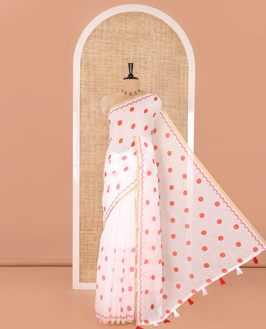 White Linen Cotton Saree, Beautified with Polka Dots All Over Its Body, Subtle Piping Border, Self-Pallu, and Paired with a Floral Printed Matching Blouse