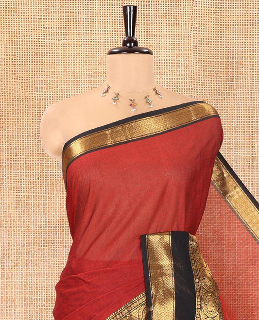 Maroon Plain Chettinad Cotton Saree, Complemented by Contrast Traditional Zari Border of Round Peacock Designs, Subtly Striped Pallu, and Paired with a Matching Blouse