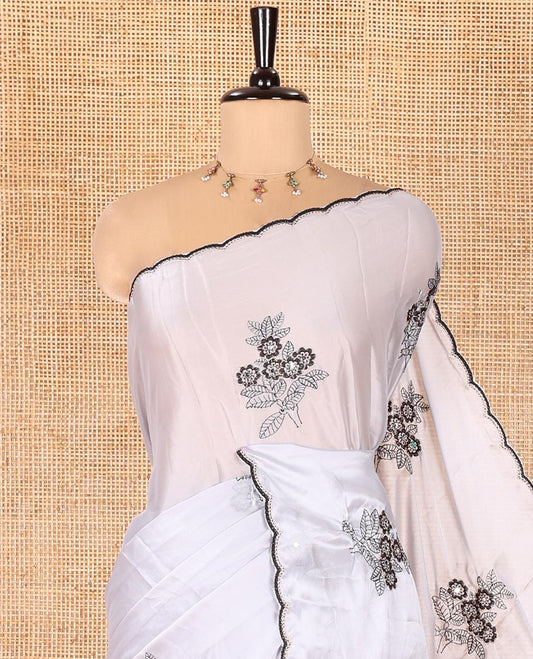 Grey Rangoli Chiffon Saree, Ornamented with Flower-Style Motifs Embroidered on Its Body, a Subtle Scallop Embroidered Border, a Self-Pallu, and Paired with a Contrast Embroidered Blouse