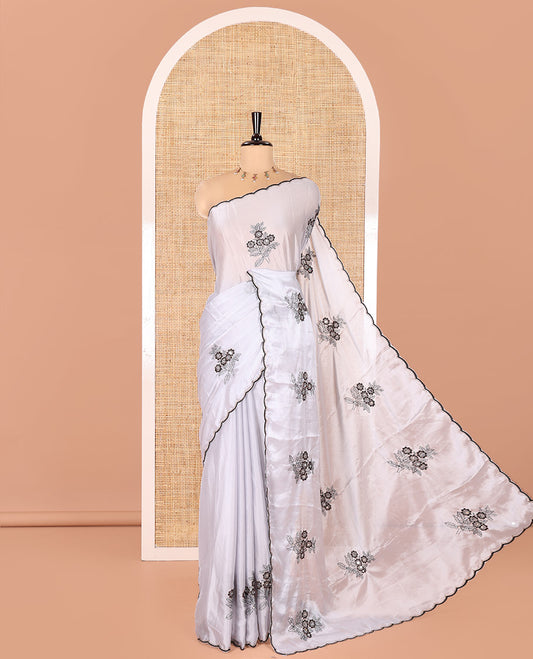 Grey Rangoli Chiffon Saree, Ornamented with Flower-Style Motifs Embroidered on Its Body, a Subtle Scallop Embroidered Border, a Self-Pallu, and Paired with a Contrast Embroidered Blouse