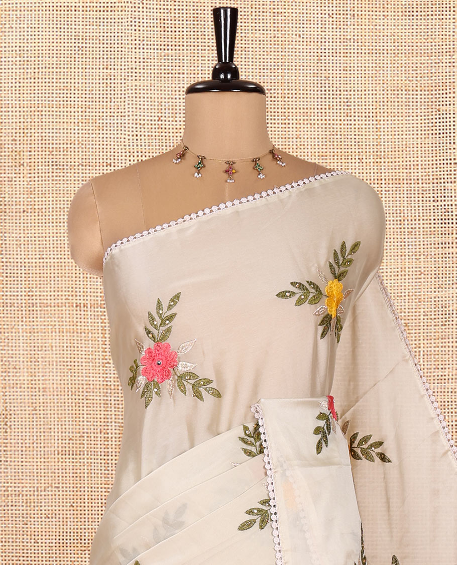 Light Grey Rangoli Chiffon Saree, Artfully Embroidered with Floral Motifs in Thread and Stone Work On Its Body, Subtly Sparkled with Lace Border, a Self-Pallu, and Paired with a Contrast Floral Embroidered Blouse