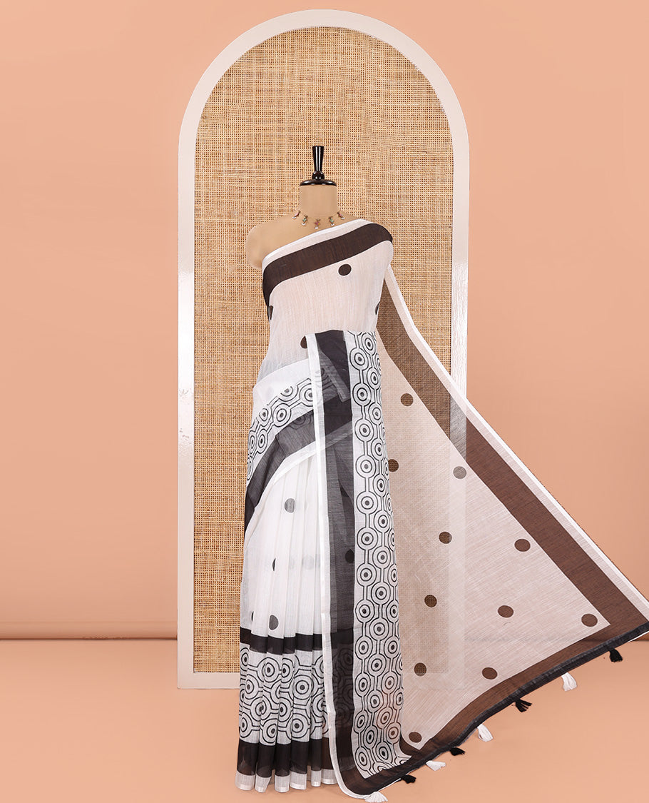 White and Black Linen Cotton Saree, Accentuated with Polka Dot Motifs All Over Its Body, Complemented by Contrast Geometric Patterned Border, a Self-Pallu and Paired with a Contrast Blouse