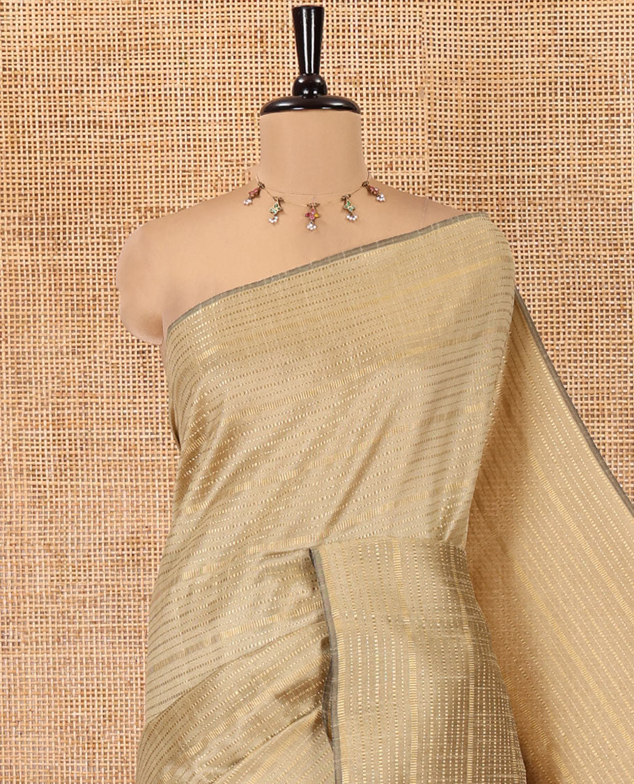 Borderless Chikku Semi-Raw Silk Saree, Subtly Sparkled with Muthu Stripes on Its Body, Complemented by a Contrast Zari Striped Pallu, and Paired with a Contrast Blouse