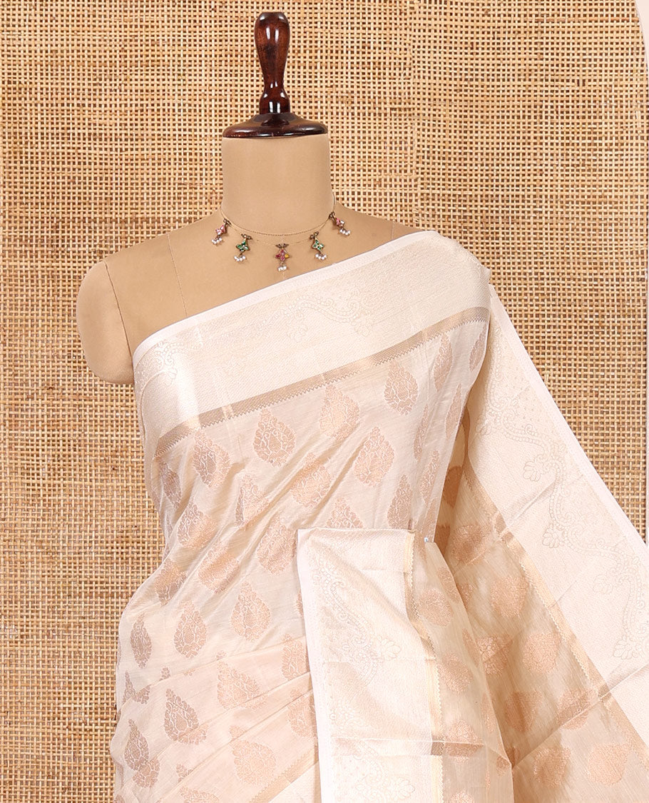 Off-white Semi-Tussar Saree, Enthralled with Zari Buttas, a Satin Embossed Border, Gleaming Pallu, and a Matching Blouse
