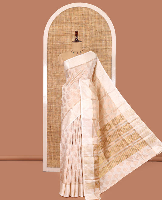 Off-white Semi-Tussar Saree, Enthralled with Zari Buttas, a Satin Embossed Border, Gleaming Pallu, and a Matching Blouse
