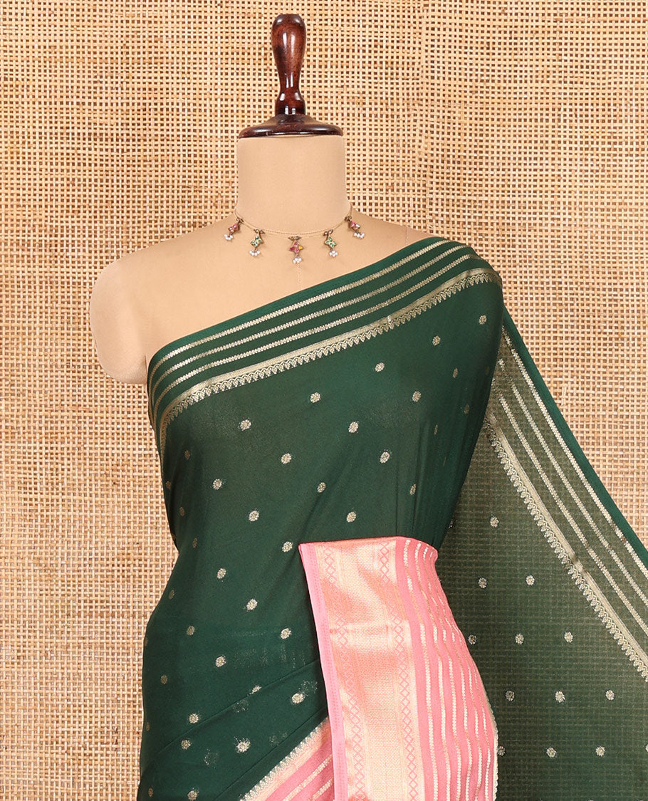 Green Art Crepe Saree Features Zari Buttas, Complemented by Contrast Traditional Zari Border, Zari Striped Pallu, and a Contrast Blouse