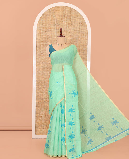 Borderless Green Linen Cotton Saree Features Lotus Print, a Self-Pallu, and a Matching Blouse