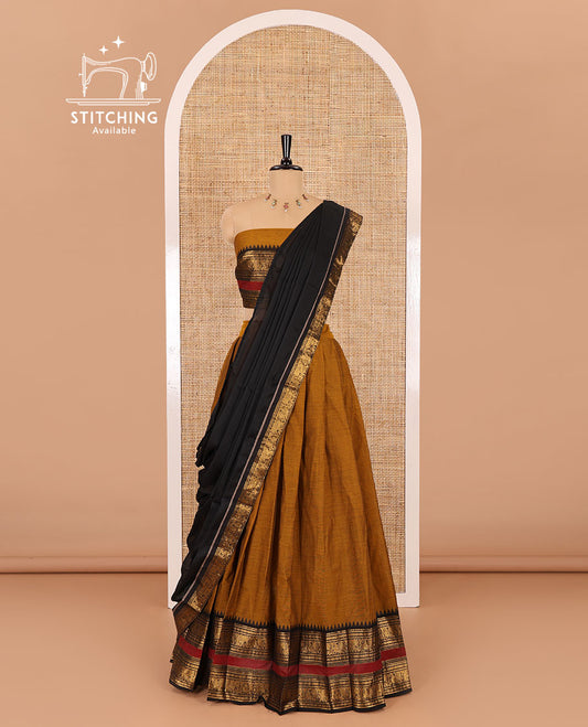 Mustard-black sungudi cotton half-saree, plain with contrast traditional zari varisai pettu bordered skirt, a matching blouse, and a zari bordered dhavani