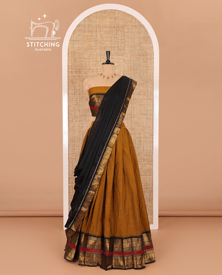 Mustard-black sungudi cotton half-saree, plain with contrast traditional zari varisai pettu bordered skirt, a matching blouse, and a zari bordered dhavani