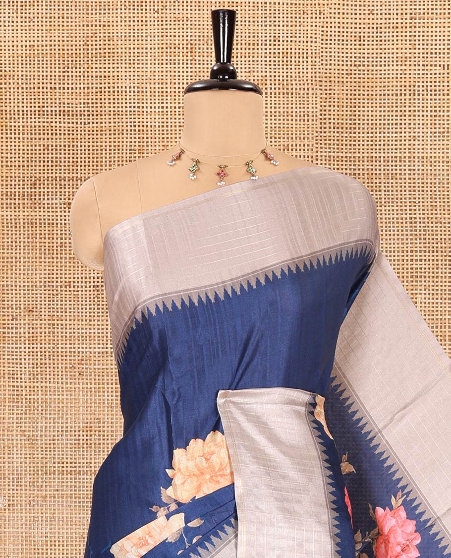 Ink blue floral motifs printed fancy tussar saree, contrast temple checked border, checked pallu, and a contrast checks and floral printed blouse