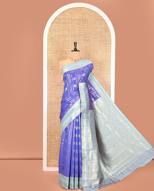 Royal Blue Litchi Saree, Detailed with Vaira Oosi Stripes and Zari Buttas on Its Body, Complemented by a Contrast Rettai Pettu Traditional Zari Design Border, an Intricately Designed Pallu, and Paired with a Contrast Blouse