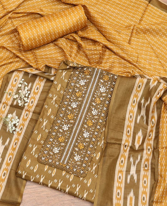 Green Material Chudidar Set, Adorned with Ikkat-Style Buttas Printed and Neck Embroidery Cotton Top, Complemented by Contrast Printed Cotton Bottom, and Paired with Ikkat-Style Printed Cotton Dupatta