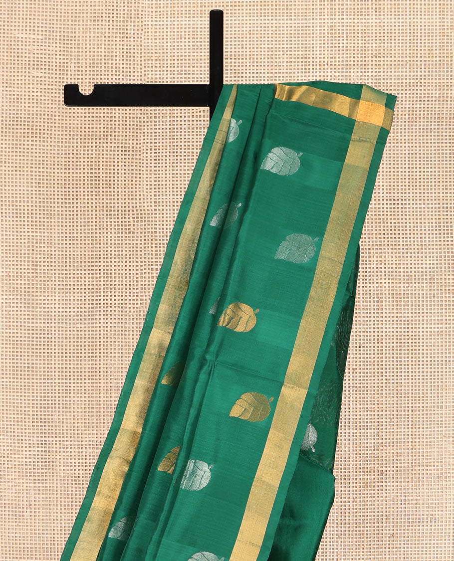 Green Uppada Silk Saree, Subtly Sparkled with Leaf Zari Buttas All Over Its Body, Subtle Bavanji Border, Pallu Steeped with Leaf Buttas, and Paired with a Matching Blouse
