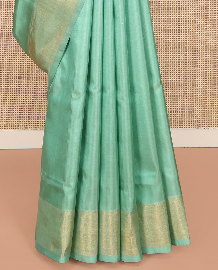 Green Uppada Silk Saree, Bedecked with Meena Zari Buttas on Its Body, Subtle Bavanji Border, Pallu of Meenakari Zari Buttas, and Paired with a Matching Blouse