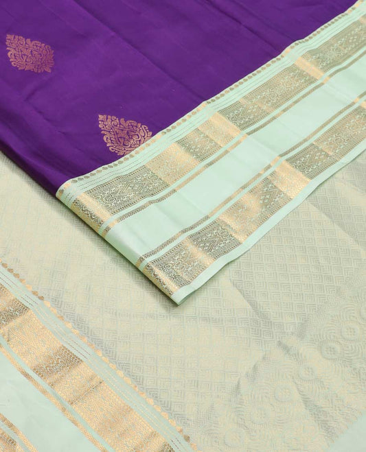 Violet zari buttas Vasundhara silk mix saree, contrast rettai pettu border of thilakam, muthu, diamond, and kathir designs, and jaal pallu