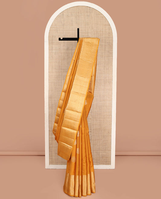 Yellow Vasundhara Lite Silk Mix Saree, Decorated with Zari Buttas, Highlighted by a Zari Border of Thilakam Mokku, Muthu, Kamalam, Mayil, Yaanai, Rettai Neli, and Mayil Kann Designs, Pallu of Mayil Kann Designs, and Paired with a Matching Blouse