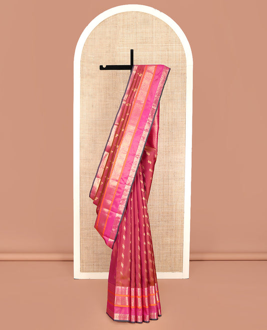 Orange Vasundhara Lite Silk Mix Saree, Graced with Zari Buttas, Complemented by a Contrast Border of Rekku, Rudraksham, Mayil Kann, Kathir, Jada Nagam, and Thilakam Designs, Intricately Designed Pallu, and Paired with a Contrast Blouse