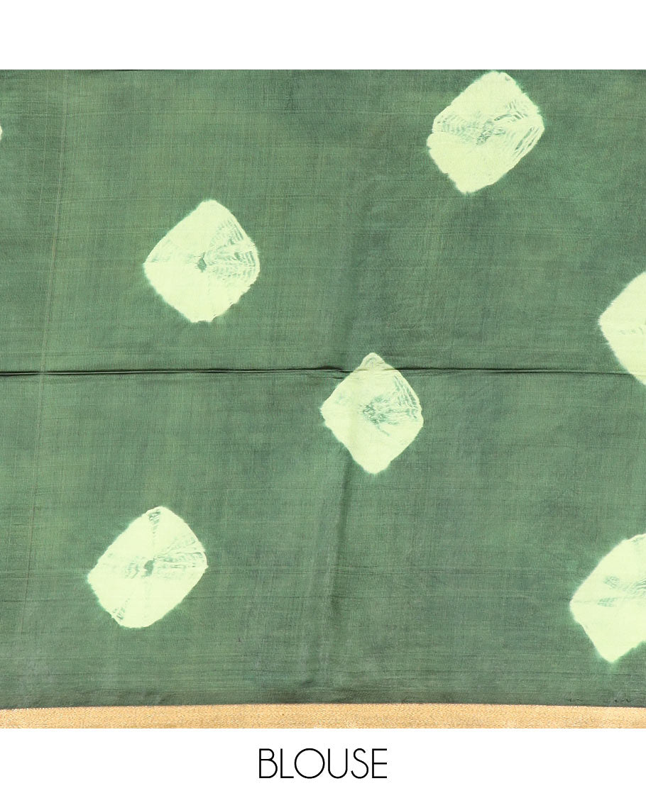 Green shibori printed banana pith saree, zari piping border, and zari striped pallu