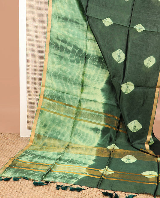 Green shibori printed banana pith saree, zari piping border, and zari striped pallu