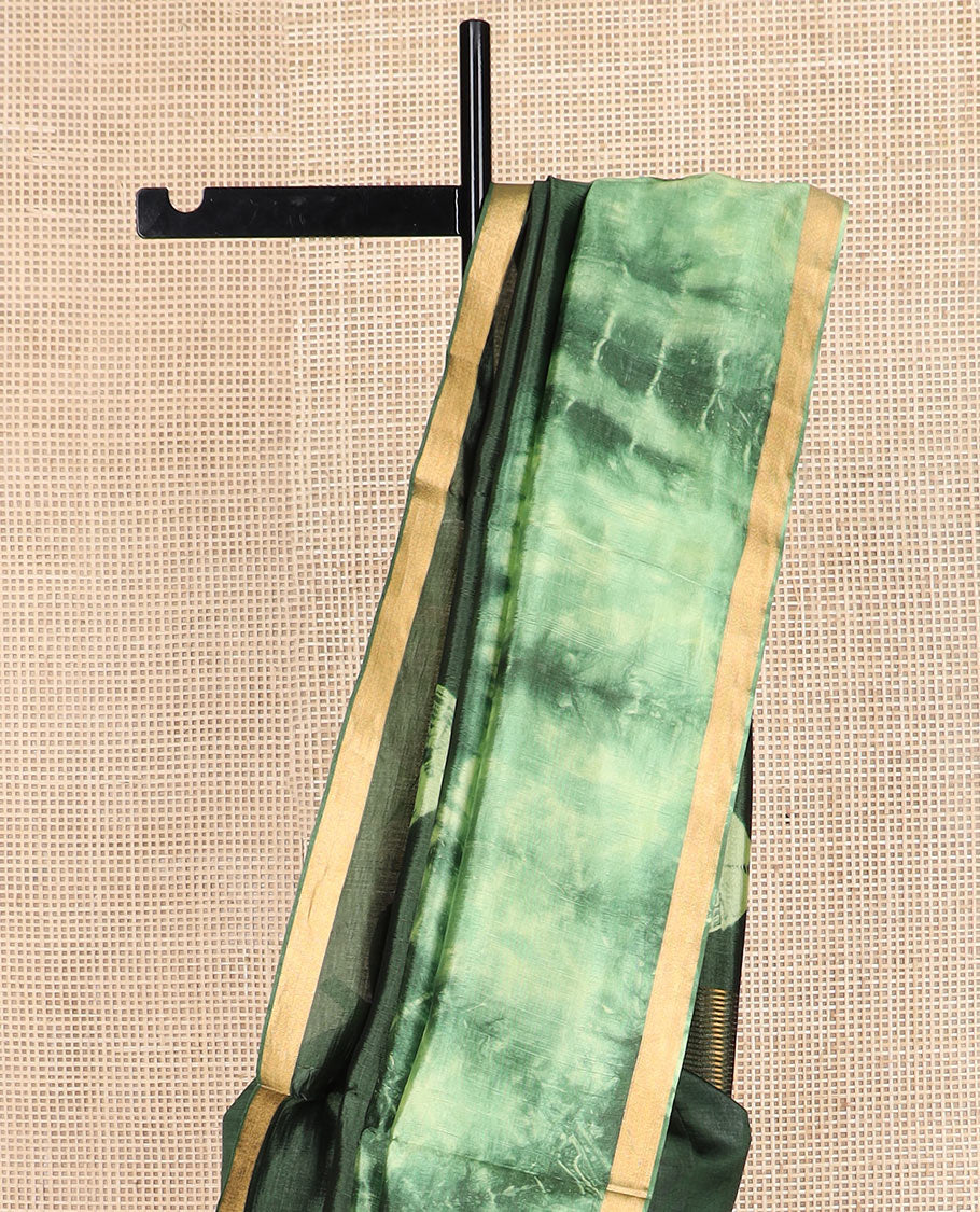 Green shibori printed banana pith saree, zari piping border, and zari striped pallu