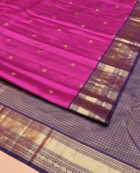 Rani Pink Vasundhara Silk Saree Spotlighted with Mayil Buttas, Complemented by a Contrast Border of Thialakam Mokku, Puli Nagam, Mayil Kann, Yaanai, and Chakram Designs, Pallu of Kamalam Enclosed Checks, and a Contrast Blouse