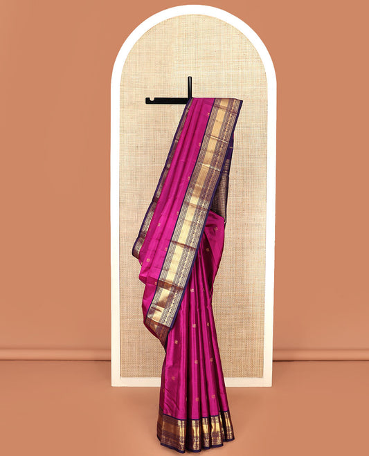 Rani Pink Vasundhara Silk Saree Spotlighted with Mayil Buttas, Complemented by a Contrast Border of Thialakam Mokku, Puli Nagam, Mayil Kann, Yaanai, and Chakram Designs, Pallu of Kamalam Enclosed Checks, and a Contrast Blouse