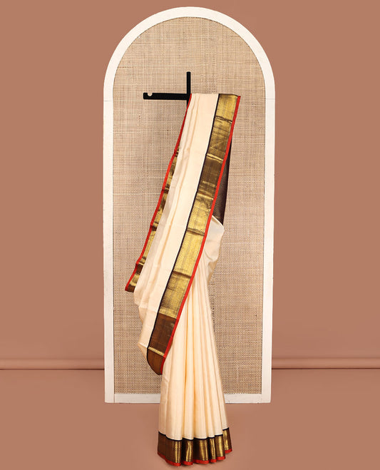 Cream Vasundhara Lite Silk Mix Saree, Sparsely Woven with Stripes on Its Body, Complemented by a Contrast Border of Thilakam, Pai Yaadi, Neli, and Mayil Kann Designs, Intricately Designed Pallu, and Paired with a Contrast Blouse